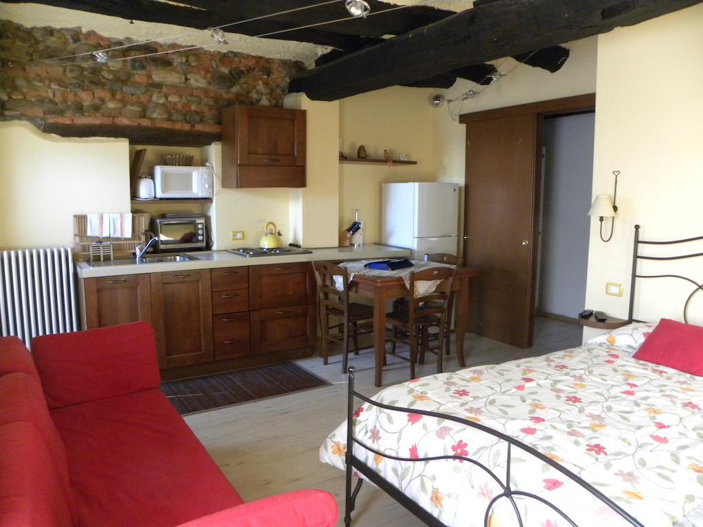 Agriturismo Fano'S Farm Suno Room photo