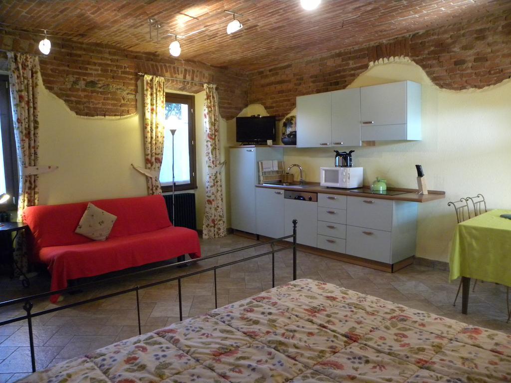Agriturismo Fano'S Farm Suno Room photo